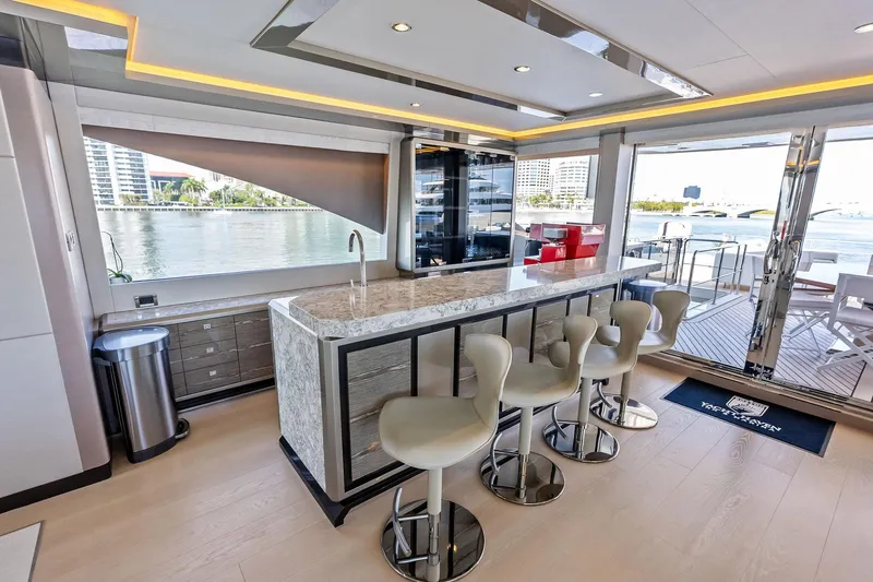 Serenity Now Yacht Photos Pics Luxurious interior of 2024 Ocean Alexander 35 Revolution yacht with modern bar and seating.