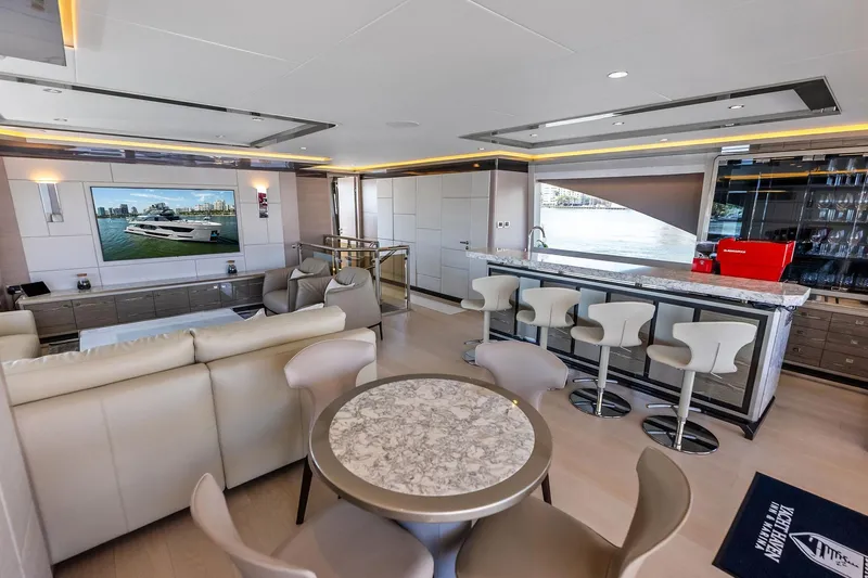 Serenity Now Yacht Photos Pics Luxurious interior of 2024 Ocean Alexander 35 Revolution yacht with modern seating and bar area.