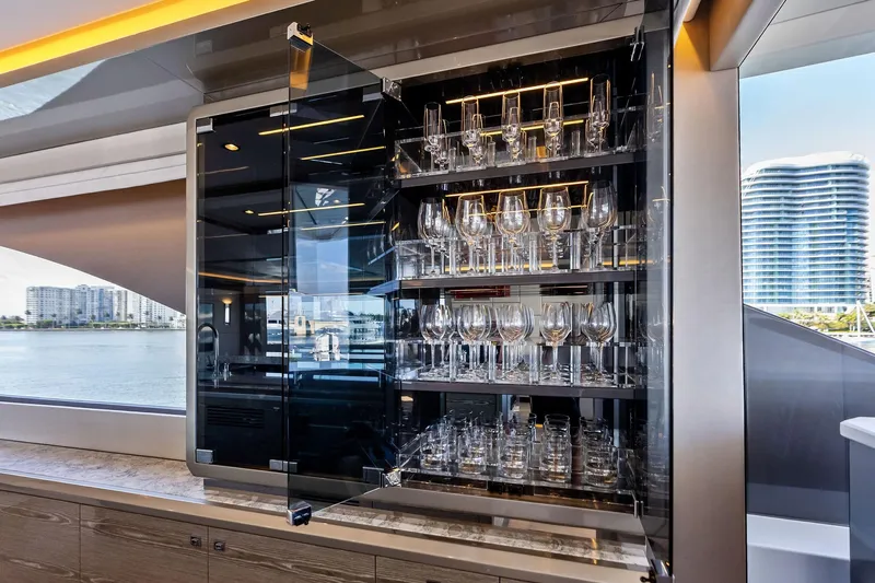 Serenity Now Yacht Photos Pics Luxurious glassware cabinet on 2024 Ocean Alexander 35 Revolution yacht.