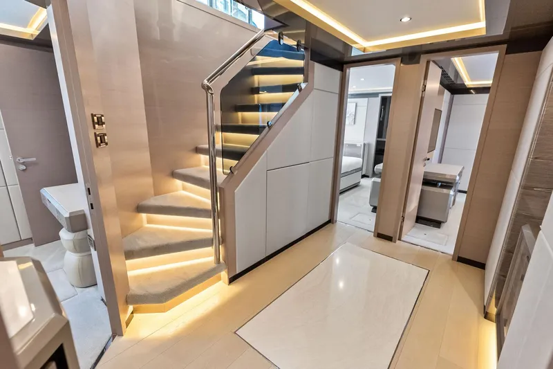 Serenity Now Yacht Photos Pics Luxurious interior of 2024 Ocean Alexander 35 Revolution yacht with modern staircase and elegant design.