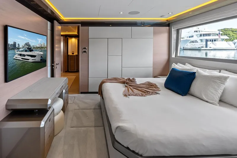 Serenity Now Yacht Photos Pics Luxurious bedroom interior of 2024 Ocean Alexander 35 Revolution yacht with modern decor and large window view.