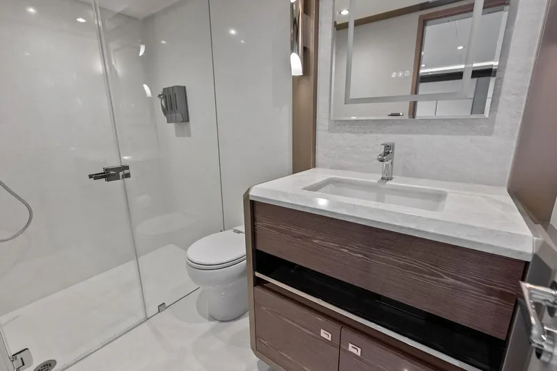 Serenity Now Yacht Photos Pics Luxurious bathroom in 2024 Ocean Alexander 35 Revolution yacht, featuring modern fixtures and elegant design.