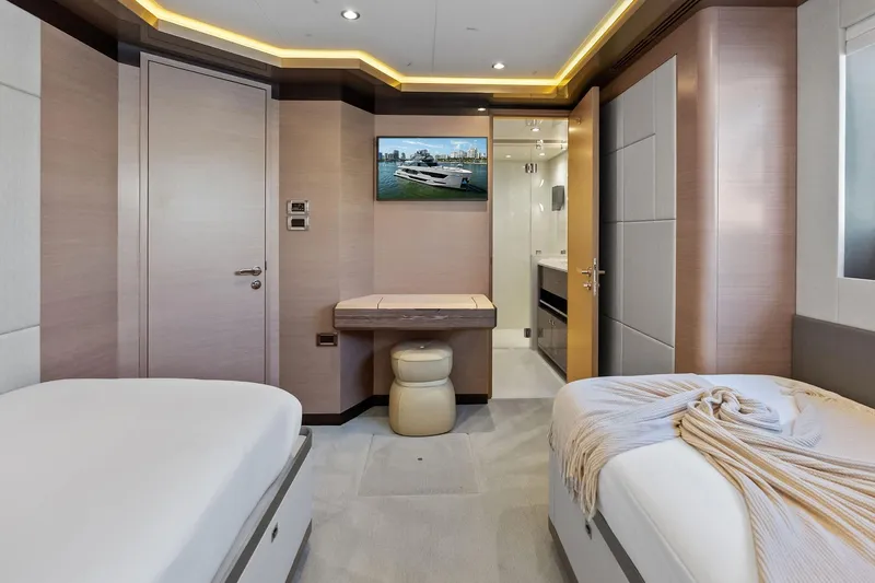 Serenity Now Yacht Photos Pics Luxurious interior of 2024 Ocean Alexander 35 Revolution yacht with twin beds and modern decor.