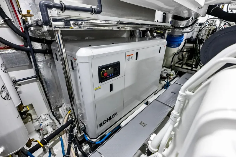 Serenity Now Yacht Photos Pics Engine room of 2024 Ocean Alexander 35 Revolution yacht featuring Kohler generator.