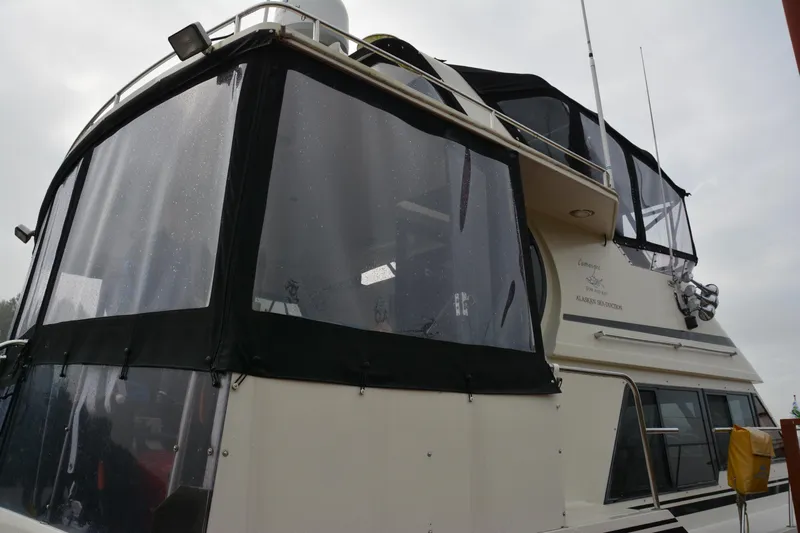 Alaska Sea Duction Yacht Photos Pics 1988 Camargue 48 Cockpit Motor Yacht with enclosed upper deck and antennas.