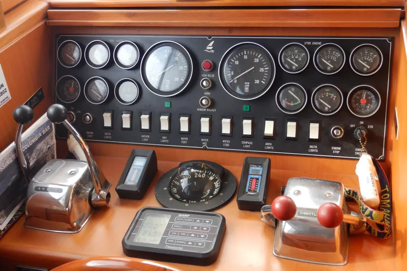 Alaska Sea Duction Yacht Photos Pics Control panel of a 1988 Camargue 48 Cockpit Motor Yacht with gauges and switches.