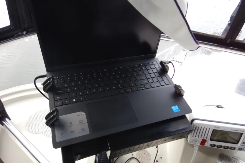 Alaska Sea Duction Yacht Photos Pics Laptop setup on 1988 Camargue 48 Cockpit Motor Yacht, near marine radio.