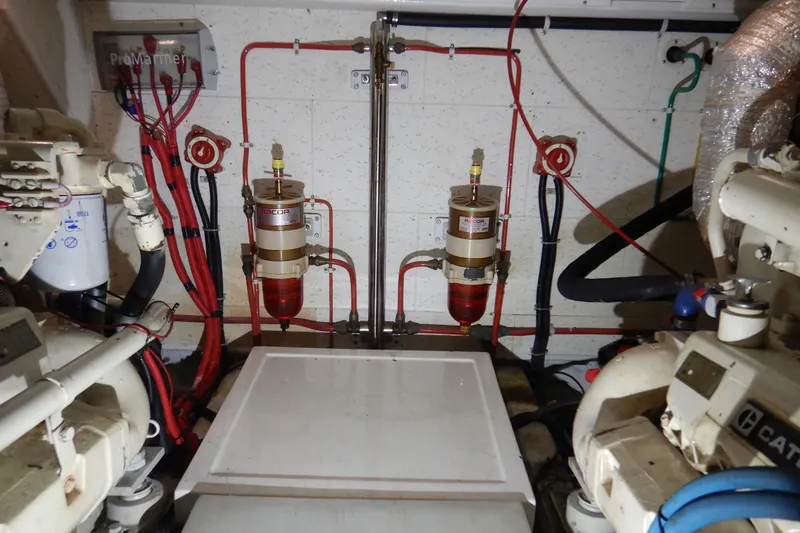 Alaska Sea Duction Yacht Photos Pics Engine room of 1988 Camargue 48 Cockpit Motor Yacht with fuel filters and wiring.