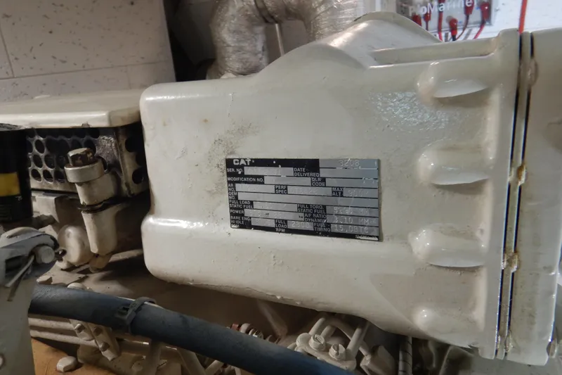 Alaska Sea Duction Yacht Photos Pics Engine compartment of 1988 Camargue 48 Cockpit Motor Yacht, featuring CAT engine details.