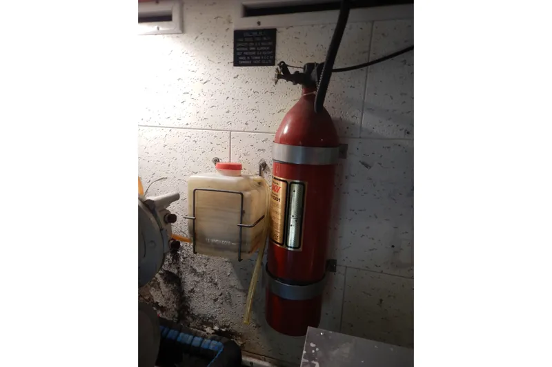 Alaska Sea Duction Yacht Photos Pics Fire extinguisher and container in 1988 Camargue 48 Cockpit Motor Yacht engine room.