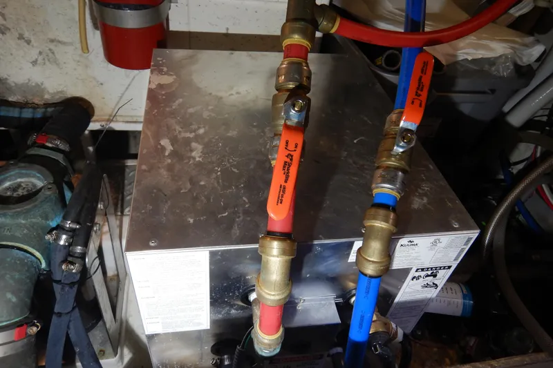 Alaska Sea Duction Yacht Photos Pics Engine room of 1988 Camargue 48 Cockpit Motor Yacht with plumbing and equipment.