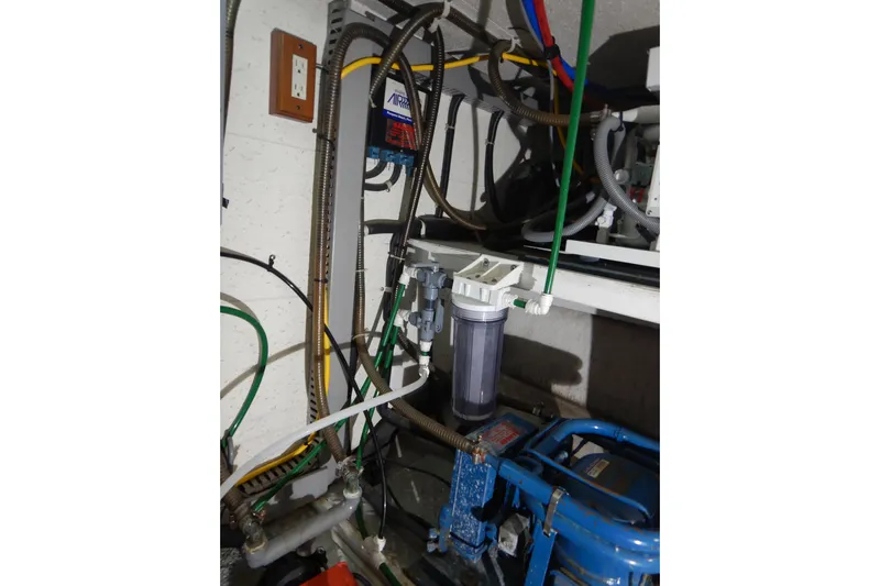 Alaska Sea Duction Yacht Photos Pics Engine room of 1988 Camargue 48 Cockpit Motor Yacht with visible wiring and components.