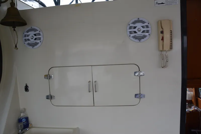 Alaska Sea Duction Yacht Photos Pics Interior of 1988 Camargue 48 Cockpit Motor Yacht with speakers and phone.