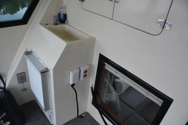 Alaska Sea Duction Yacht Photos Pics Interior of 1988 Camargue 48 Cockpit Motor Yacht with sink and electrical outlets.