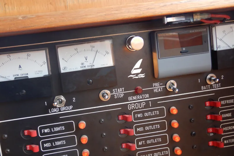 Alaska Sea Duction Yacht Photos Pics Control panel of a 1988 Camargue 48 Cockpit Motor Yacht with gauges and switches.