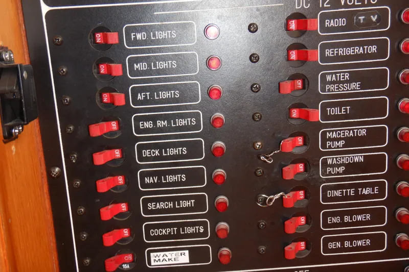 Alaska Sea Duction Yacht Photos Pics Control panel of 1988 Camargue 48 Cockpit Motor Yacht with labeled switches.