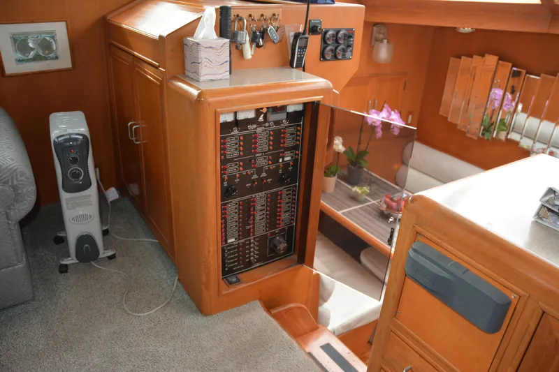 Alaska Sea Duction Yacht Photos Pics Interior of 1988 Camargue 48 Cockpit Motor Yacht with control panel and cozy seating area.