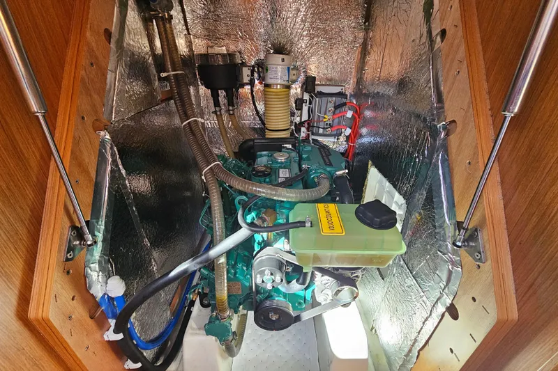 Skal Yacht Photos Pics Engine compartment of a 2021 Bavaria Cruiser 34 sailboat, showcasing mechanical components.