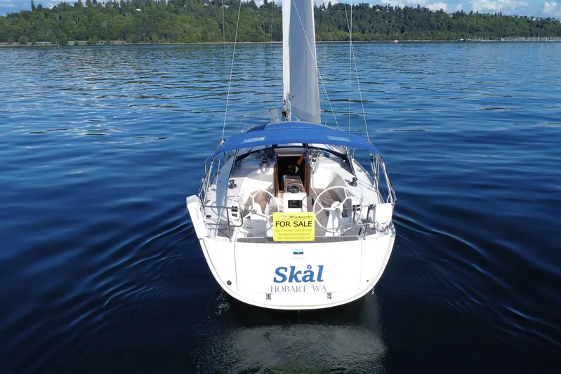 Skal Yacht Photos Pics 2021 Bavaria Cruiser 34 sailboat on calm water, for sale sign visible.