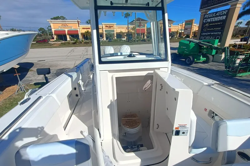 250-118 Yacht Photos Pics 2026 Robalo R250 Center Console boat with open cabin and visible interior features.