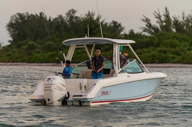Blue Horizons II Yacht Photos Pics Manufacturer Provided Image: 2023 Boston Whaler 240 Vantage boat on water with people fishing.
