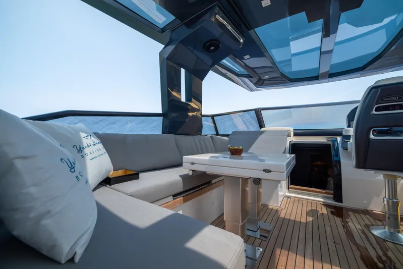  Yacht Photos Pics Luxurious interior of 2023 OKEAN 57 yacht with modern seating and panoramic views.