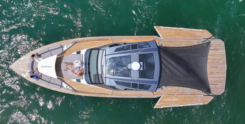  Yacht Photos Pics Aerial view of 2023 OKEAN 57 yacht with people relaxing on deck.