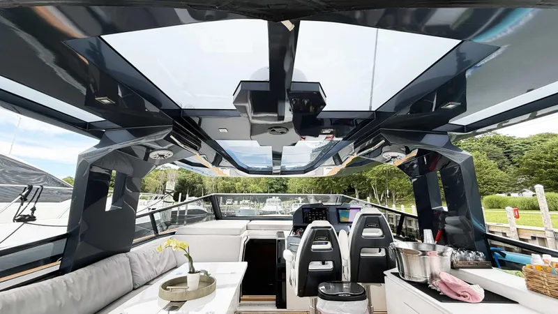  Yacht Photos Pics Luxurious interior of 2023 OKEAN 57 yacht with modern seating and panoramic windows.