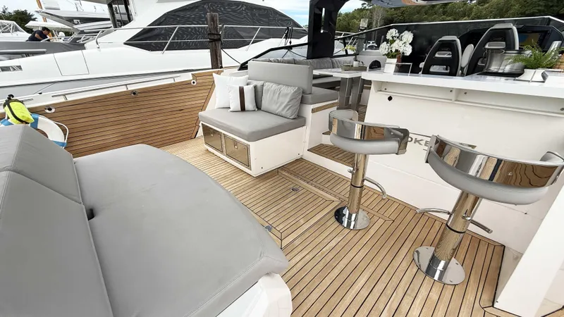  Yacht Photos Pics Luxurious 2023 OKEAN 57 yacht interior with sleek seating and modern design.