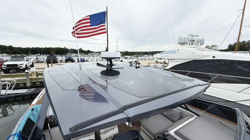  Yacht Photos Pics 2023 OKEAN 57 yacht with American flag docked at marina.