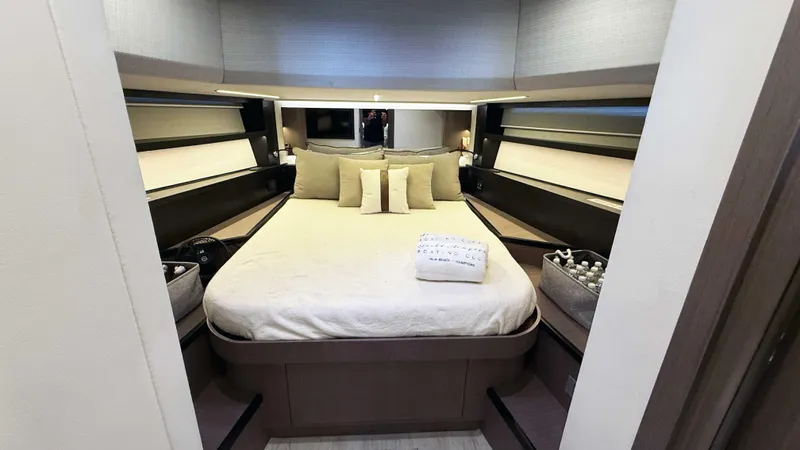  Yacht Photos Pics Luxurious bedroom interior of 2023 OKEAN 57 yacht with elegant bedding and modern design.