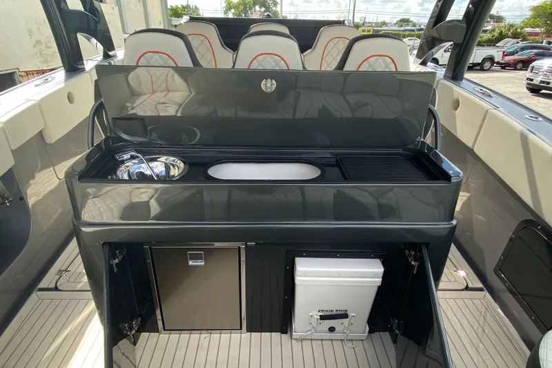  Yacht Photos Pics Luxury interior of Midnight Express 43 Open boat with sleek kitchenette and seating.