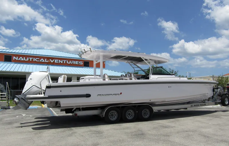  Yacht Photos Pics 2024 Axopar 37 Sun Top boat on trailer at Nautical Ventures dealership.