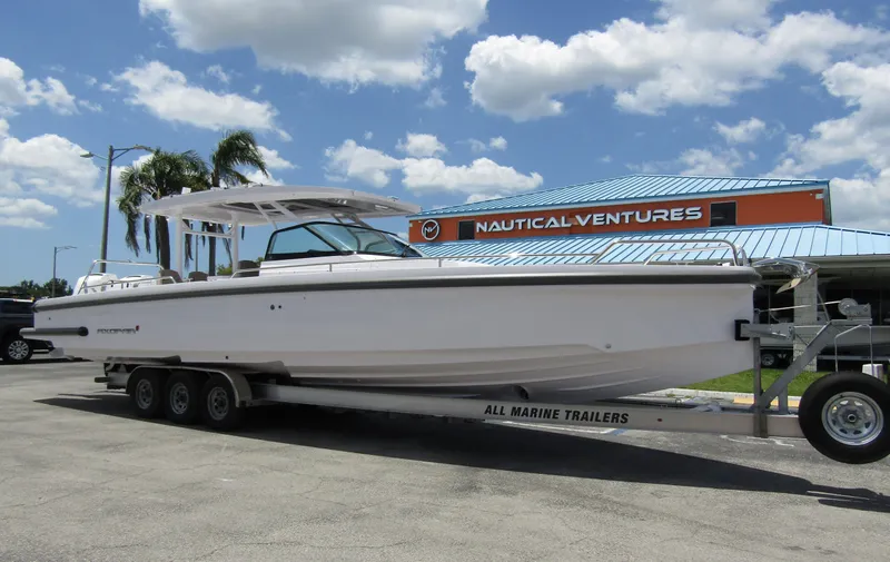  Yacht Photos Pics 2024 Axopar 37 Sun Top boat on trailer at Nautical Ventures dealership.