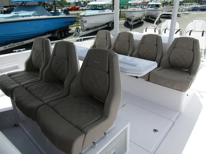  Yacht Photos Pics 2024 Axopar 37 Sun Top boat interior with luxurious seating arrangement.