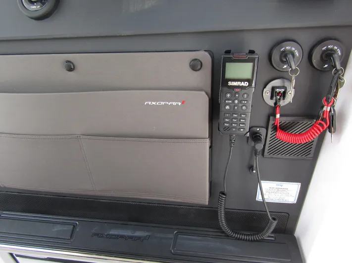  Yacht Photos Pics Control panel of 2024 Axopar 37 Sun Top with Simrad radio and key switches.