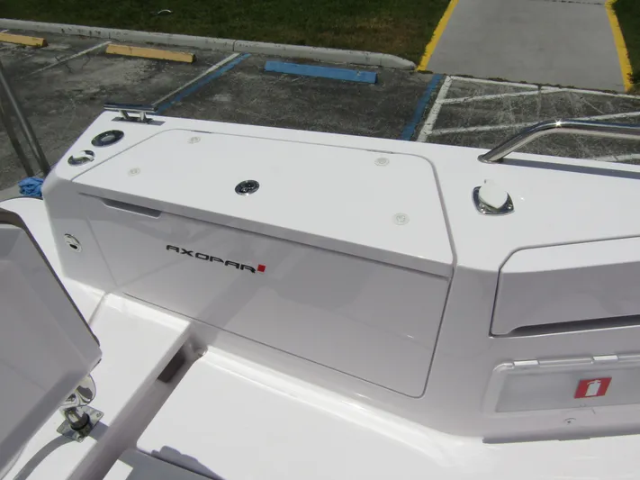  Yacht Photos Pics 2024 Axopar 37 Sun Top boat deck with storage compartments and sleek design.