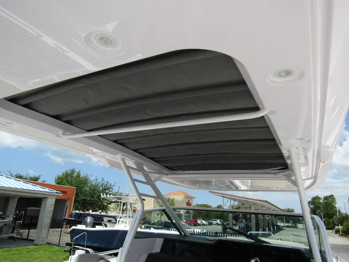  Yacht Photos Pics 2024 Axopar 37 Sun Top boat canopy, showcasing sleek design and modern features.