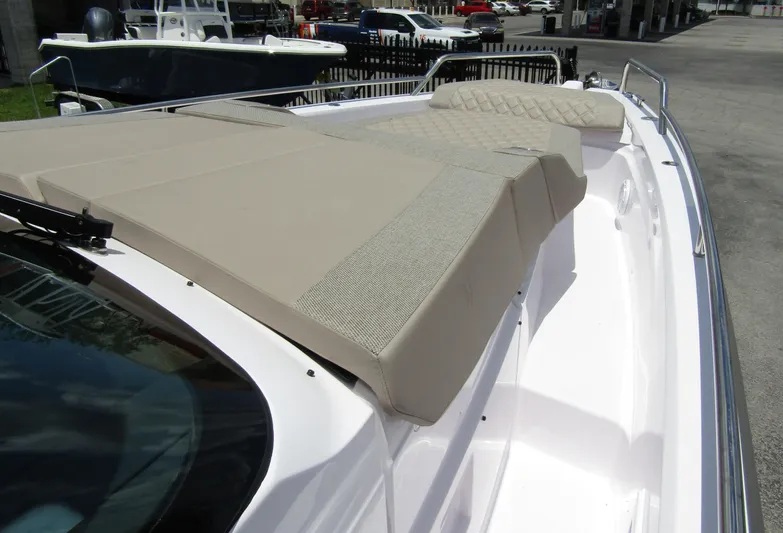  Yacht Photos Pics 2024 Axopar 37 Sun Top boat with beige sunbed on deck.