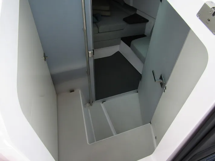  Yacht Photos Pics 2024 Axopar 37 Sun Top interior cabin with seating and modern design.