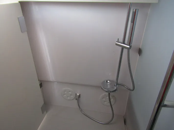  Yacht Photos Pics 2024 Axopar 37 Sun Top shower area with modern fixtures and sleek design.