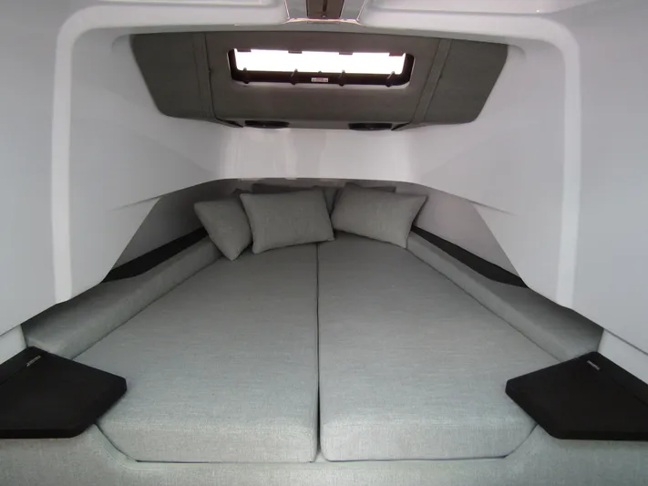  Yacht Photos Pics 2024 Axopar 37 Sun Top cabin interior with cushions and modern design.