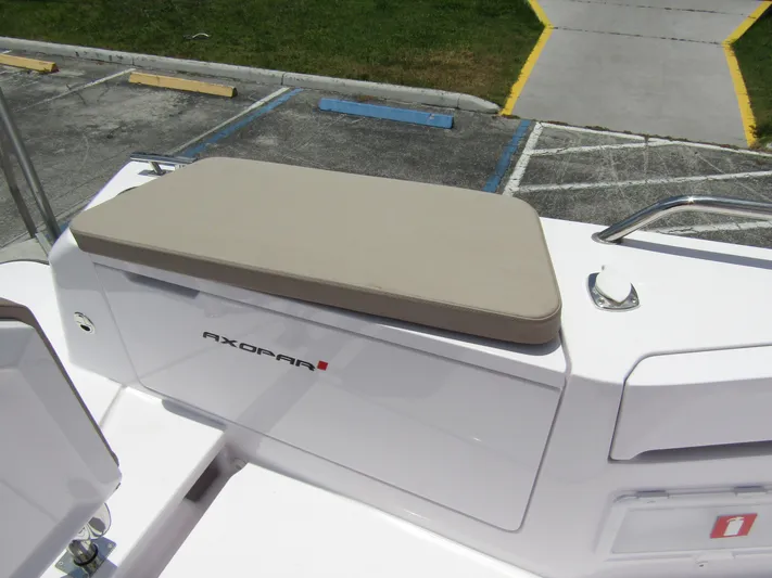  Yacht Photos Pics 2024 Axopar 37 Sun Top boat seat with beige cushion and sleek white design.