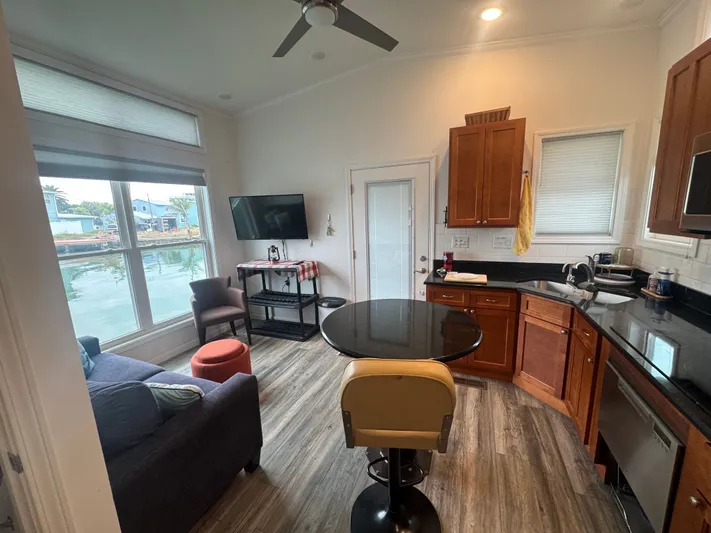  Yacht Photos Pics Interior of Harbor Cottage Tiny Boat with modern kitchen and lake view.