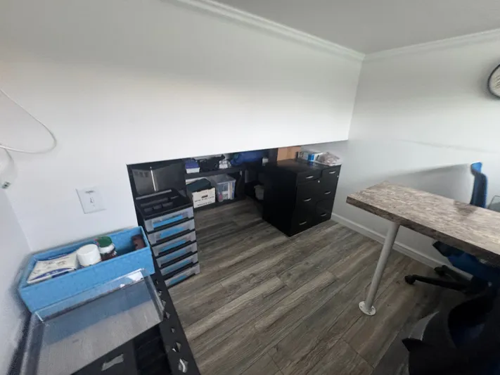  Yacht Photos Pics Interior of a 2019 Harbor Cottage tiny boat with desk and drawers.