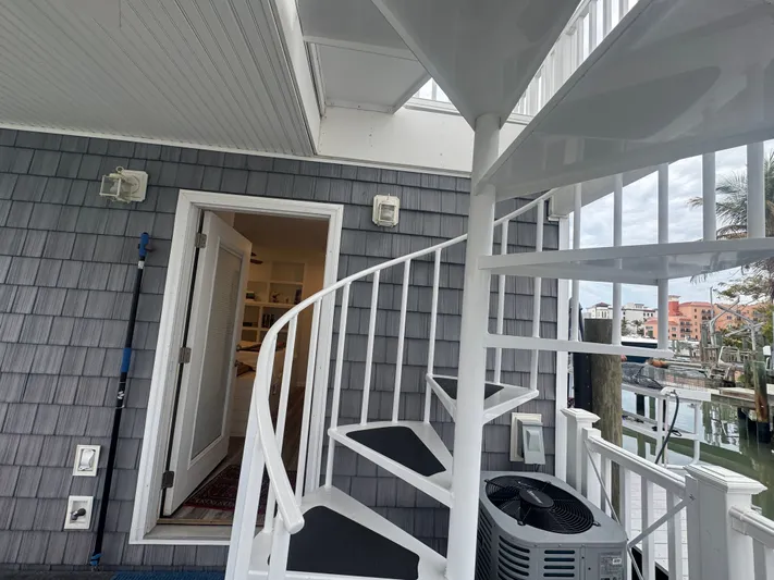  Yacht Photos Pics White spiral staircase on a Harbor Cottage tiny boat.