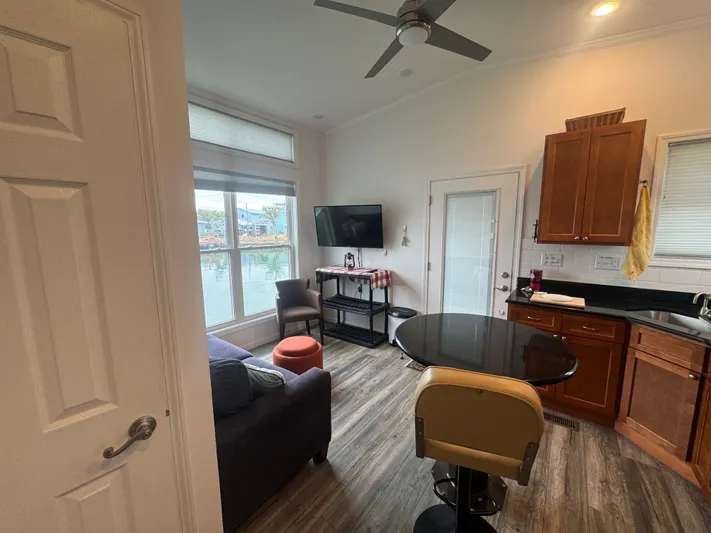  Yacht Photos Pics Interior of a 2019 Harbor Cottage tiny boat with modern kitchen.