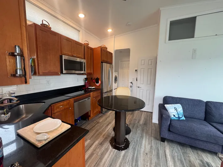  Yacht Photos Pics Interior of Harbor Cottage Cozy Cottage Tiny Boat kitchen.