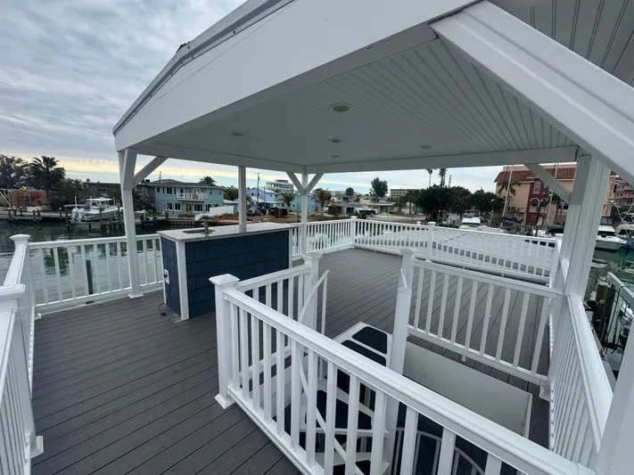  Yacht Photos Pics Deck of a 2019 Harbor Cottage tiny boat overlooking the harbor.