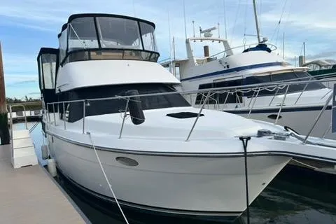 1991 Carver 33 Aft Cabin Motor Yacht docked at marina.